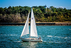 Sailboat Passes Long Island Head Light in Boston Harbor